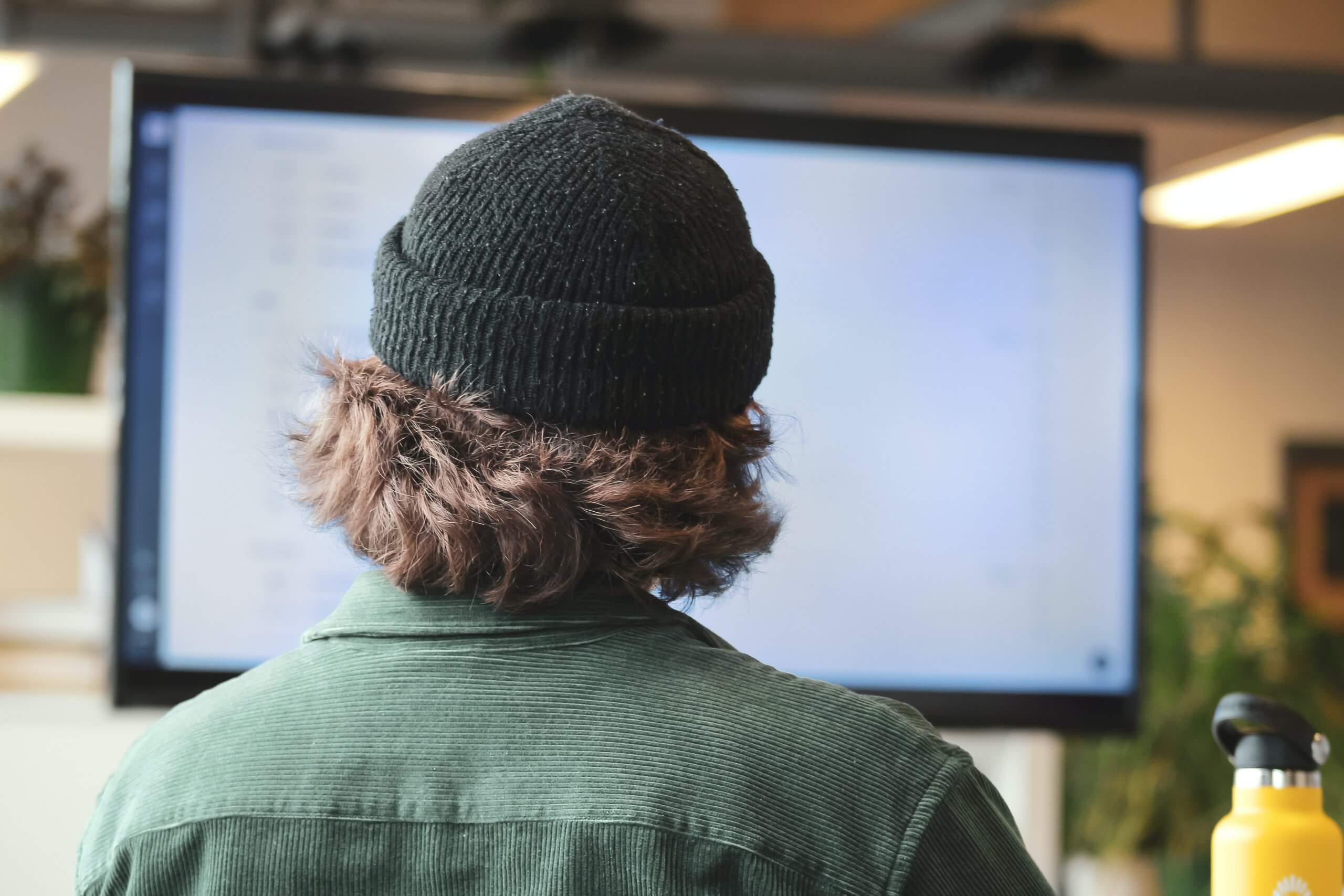 A man looking at the screen