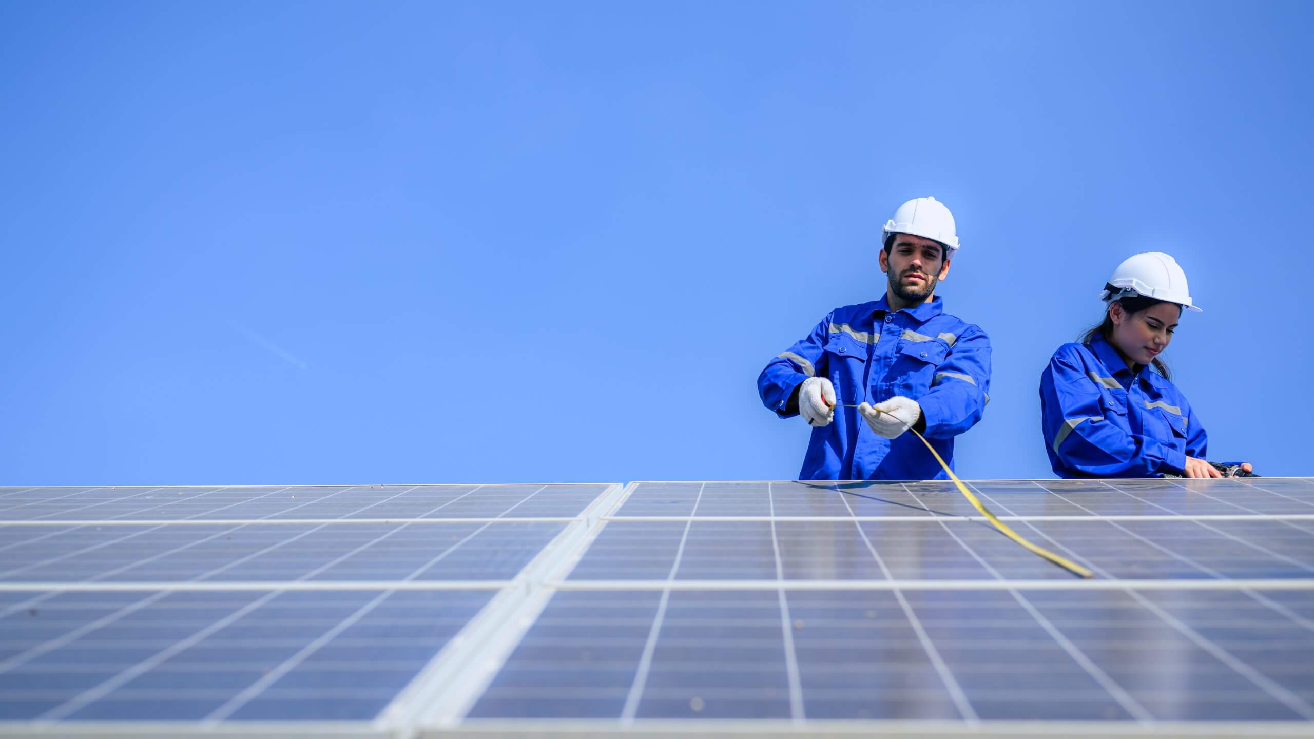 Solar panel station, Engineer installing solar panel at solar energy farm field