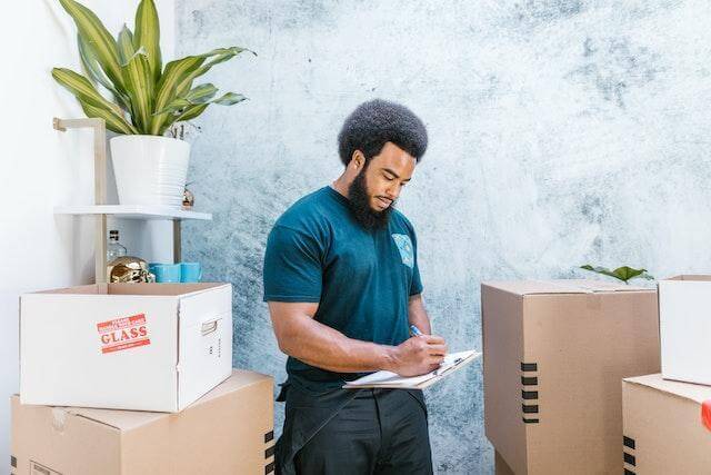 Focused guy moving into a smart house