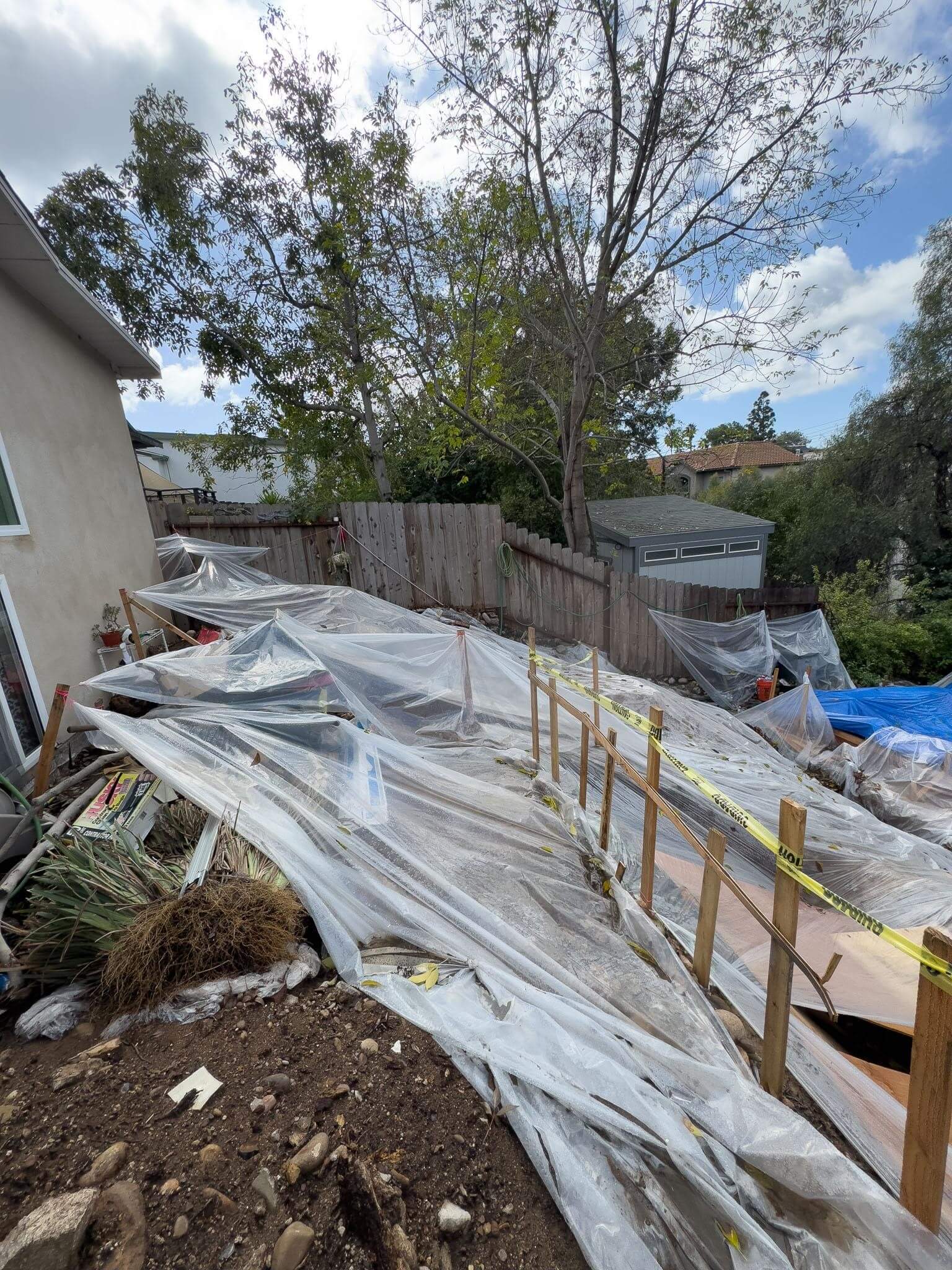 Backyard prep for a room addition during rainy season on a slopped terrain 